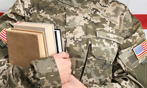 Female cadet of military school on flag background